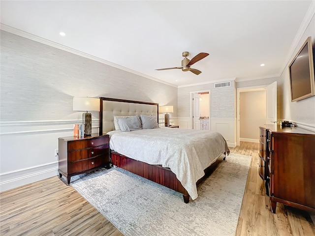 bedroom with ceiling fan, light wood-type flooring, and ornamental molding