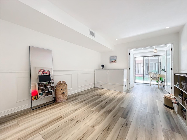 unfurnished living room featuring light hardwood / wood-style floors