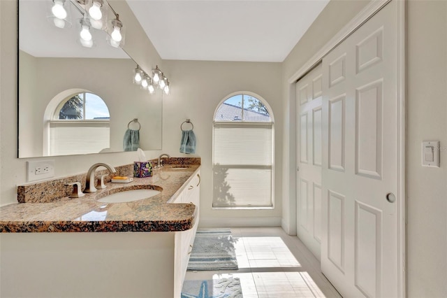 bathroom featuring tile patterned flooring and vanity