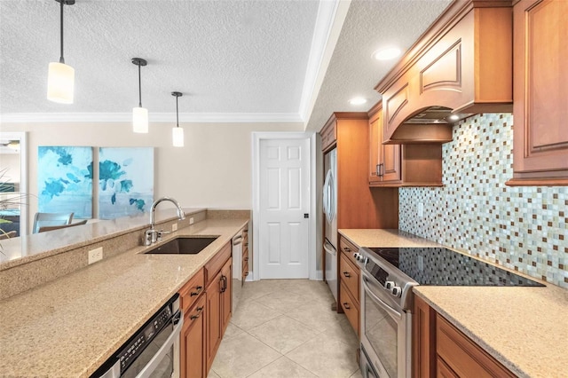 kitchen with decorative backsplash, appliances with stainless steel finishes, ornamental molding, sink, and pendant lighting