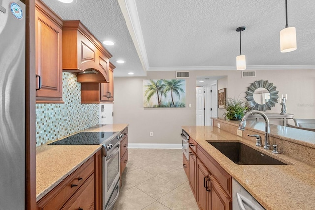 kitchen featuring hanging light fixtures, sink, crown molding, and appliances with stainless steel finishes