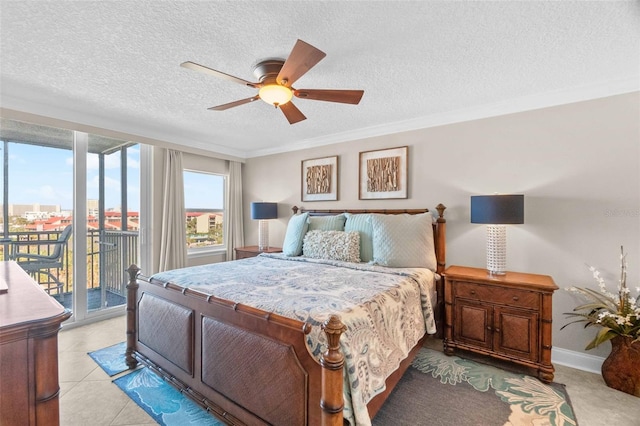 tiled bedroom with ceiling fan, access to exterior, ornamental molding, and a textured ceiling