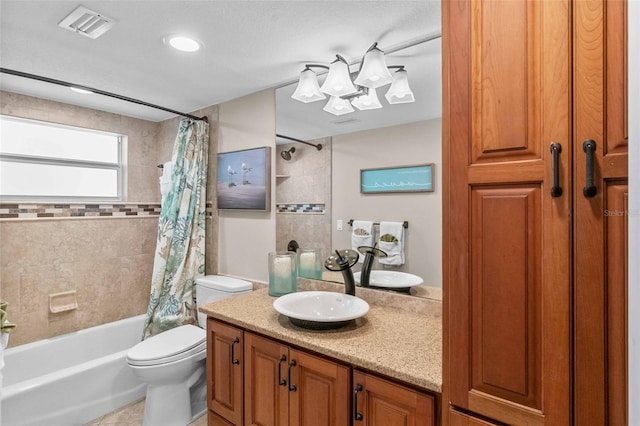 full bathroom with toilet, tile patterned floors, vanity, and shower / tub combo with curtain