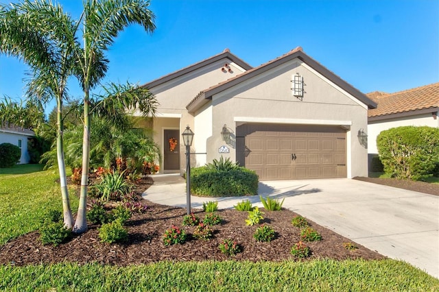 mediterranean / spanish house featuring a garage