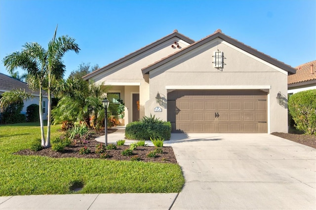 ranch-style house featuring a front yard and a garage