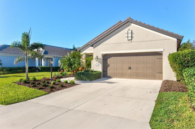 ranch-style house with a garage and a front lawn