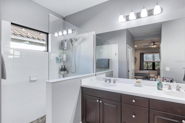 bathroom with a sink, ensuite bath, and a wealth of natural light