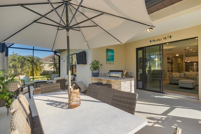 view of patio / terrace featuring outdoor dining area, an outdoor living space, an outdoor kitchen, and grilling area