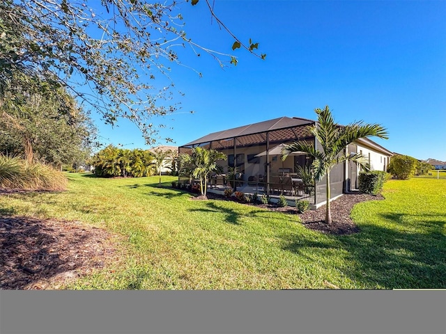 view of yard featuring a lanai