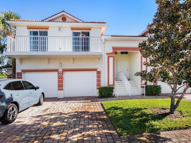 view of front facade with a garage and a front lawn