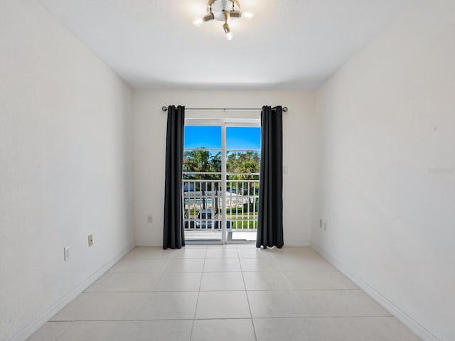 empty room with light tile patterned floors