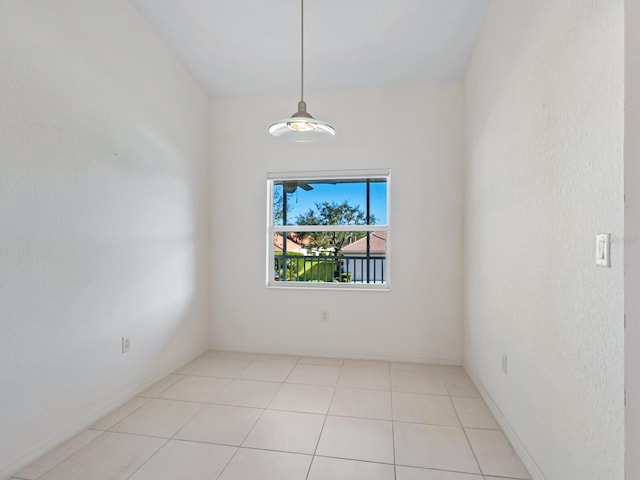 spare room featuring light tile patterned flooring