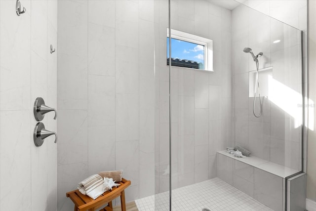 bathroom featuring a tile shower