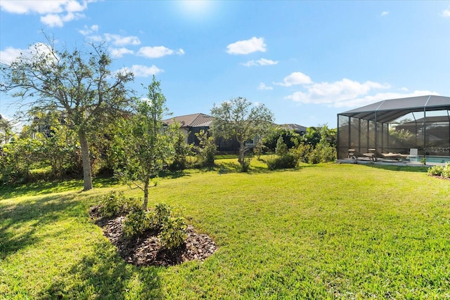 view of yard featuring a lanai