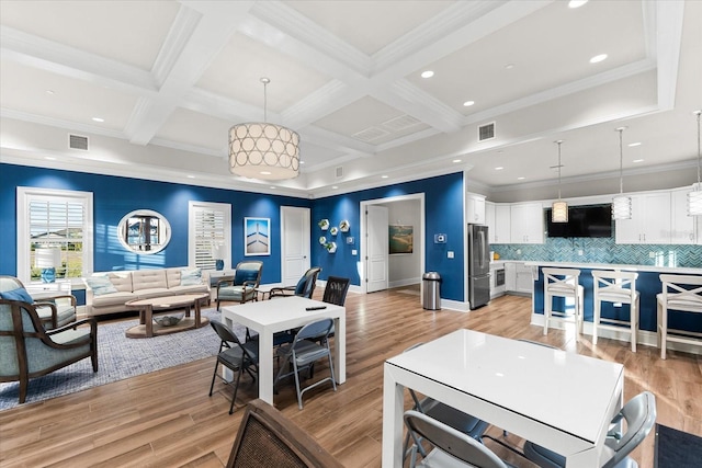 living room with crown molding, beamed ceiling, light hardwood / wood-style floors, and coffered ceiling