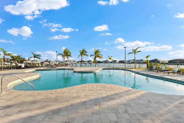 view of swimming pool featuring a patio area