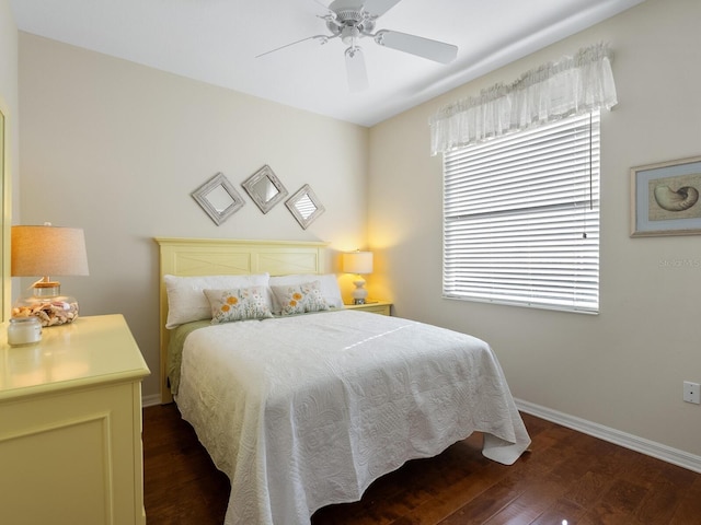 bedroom featuring dark hardwood / wood-style flooring and ceiling fan