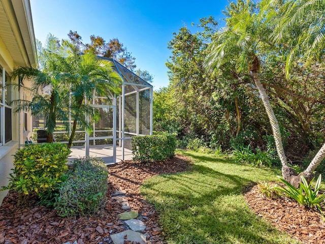 view of yard with a lanai