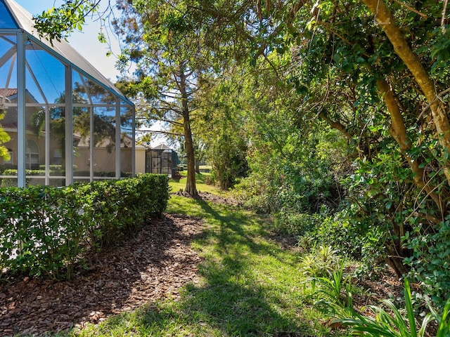 view of yard featuring a lanai