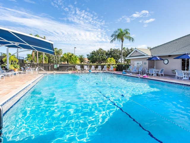 view of swimming pool with a patio