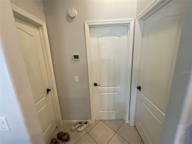 hallway featuring light tile patterned flooring