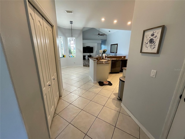 kitchen with ceiling fan, dishwasher, kitchen peninsula, pendant lighting, and light tile patterned floors