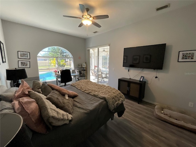 bedroom with access to outside, ceiling fan, and hardwood / wood-style flooring