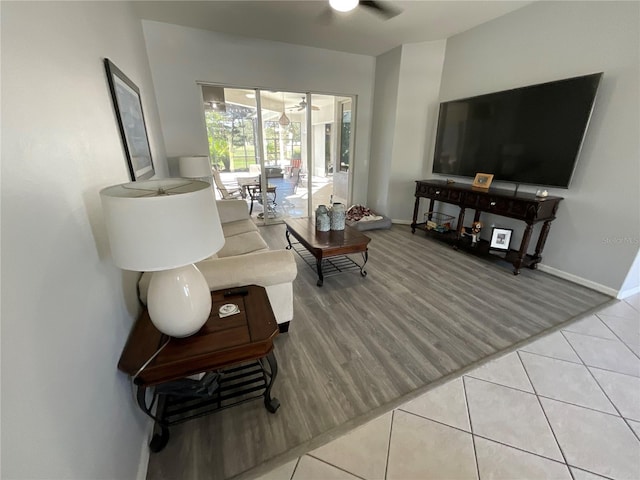 living room with ceiling fan and hardwood / wood-style floors