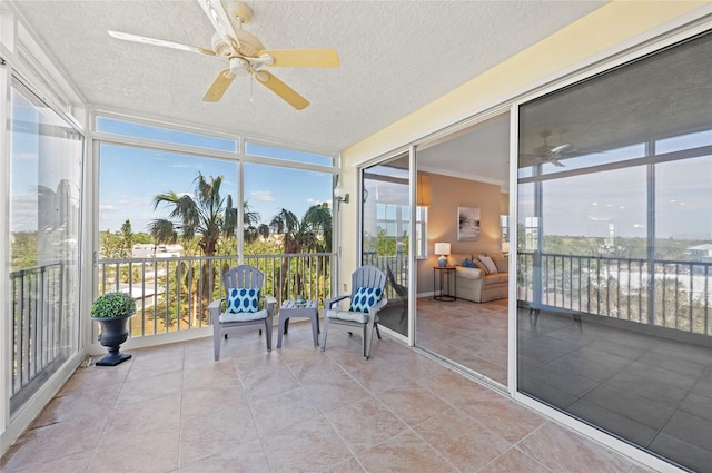 sunroom with ceiling fan and a wealth of natural light