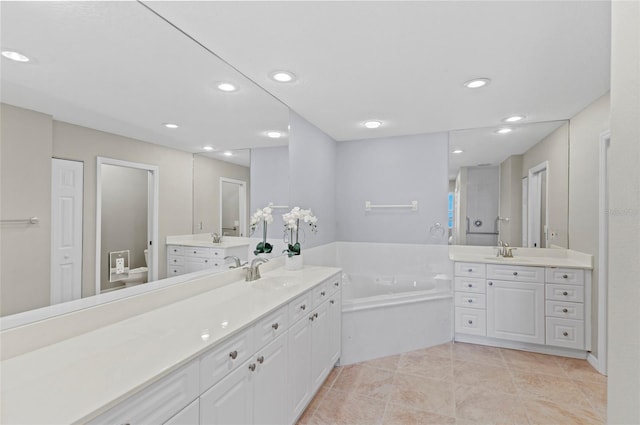 bathroom featuring tile patterned flooring, vanity, and toilet