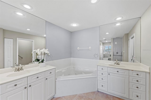 bathroom with tile patterned floors, separate shower and tub, vanity, and a textured ceiling