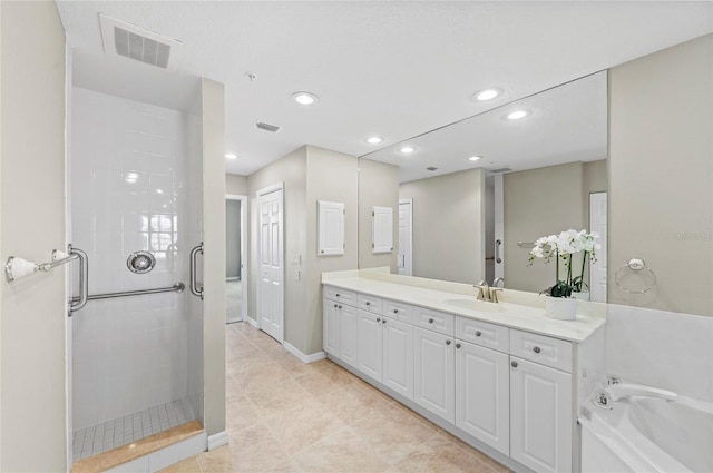 bathroom featuring tile patterned floors, vanity, and shower with separate bathtub