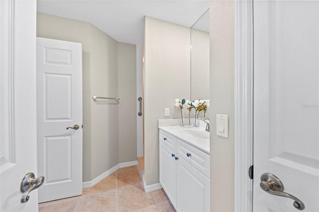 bathroom with tile patterned flooring and vanity