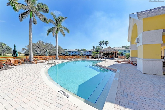 view of swimming pool with a gazebo and a patio