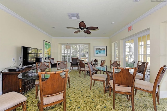 interior space with crown molding, ceiling fan, and a healthy amount of sunlight