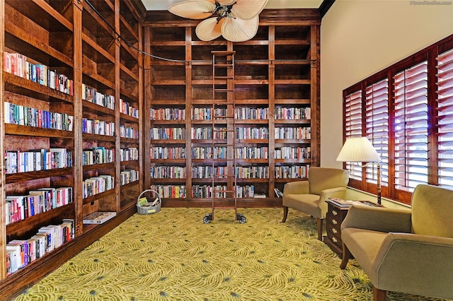 sitting room featuring ceiling fan