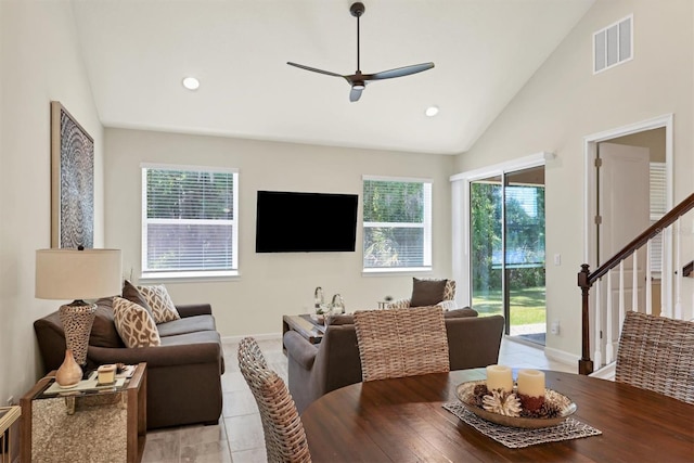 dining space with a healthy amount of sunlight, high vaulted ceiling, and ceiling fan