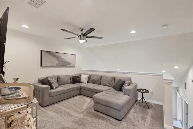 carpeted living room with ceiling fan