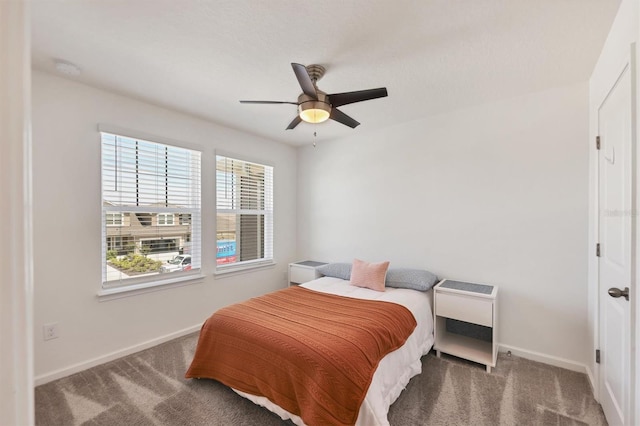 carpeted bedroom featuring ceiling fan