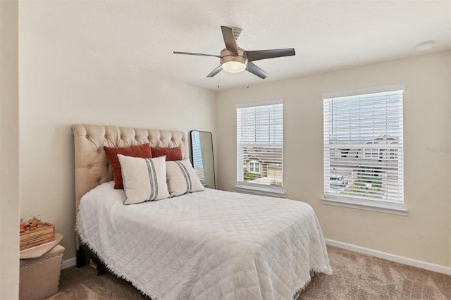 bedroom featuring ceiling fan and carpet flooring