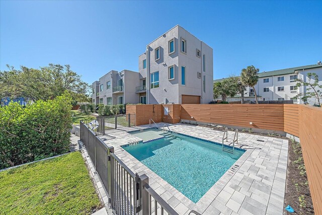 view of swimming pool with a patio