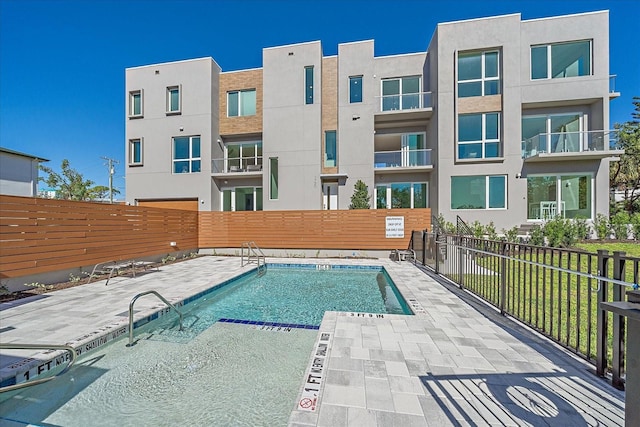 view of swimming pool with a patio