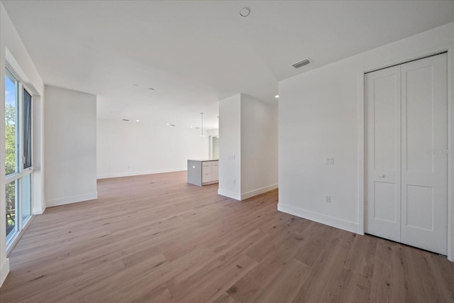 unfurnished living room with light hardwood / wood-style flooring