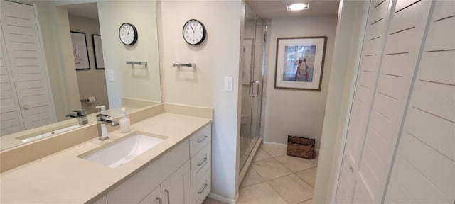 bathroom with tile patterned floors, vanity, and a shower with shower door