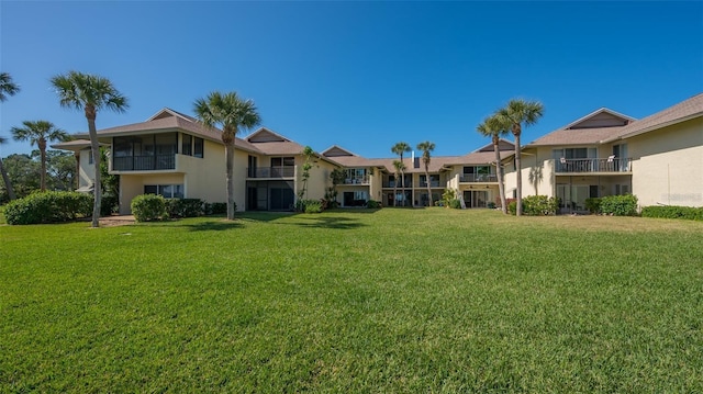 view of home's community with a lawn