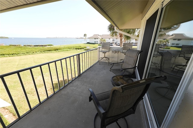 balcony featuring a water view