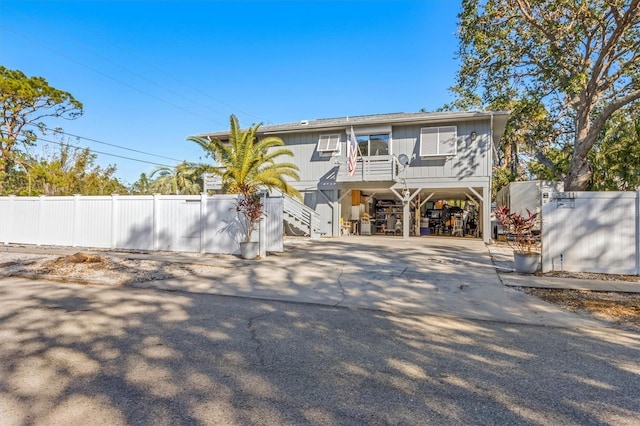 3511 Camino Real, Sarasota, FL 34239 - back of property with a carport, stairway, and driveway