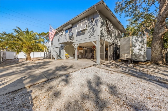 3511 Camino Real, Sarasota, FL 34239 - view of front of property featuring a carport, stairway, driveway, and a shed