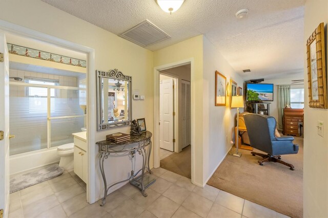 3511 Camino Real, Sarasota, FL 34239 - office area with plenty of natural light, a textured ceiling, and light tile patterned floors