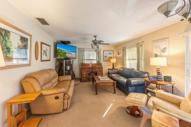3511 Camino Real, Sarasota, FL 34239 - living room featuring light colored carpet, a ceiling fan, and a textured ceiling